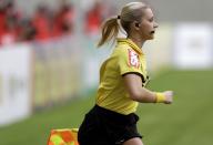 Brazil's referee assistant Fernanda Colombo Uliana runs during the Brazilian championship soccer match between Atletico Mineiro and Cruzeiro in Belo Horizonte May 11, 2014. Uliana has just been granted FIFA official status by the refereeing committee of the Brazilian Football Confederation. REUTERS/Washington Alves (BRAZIL - Tags: SPORT SOCCER)