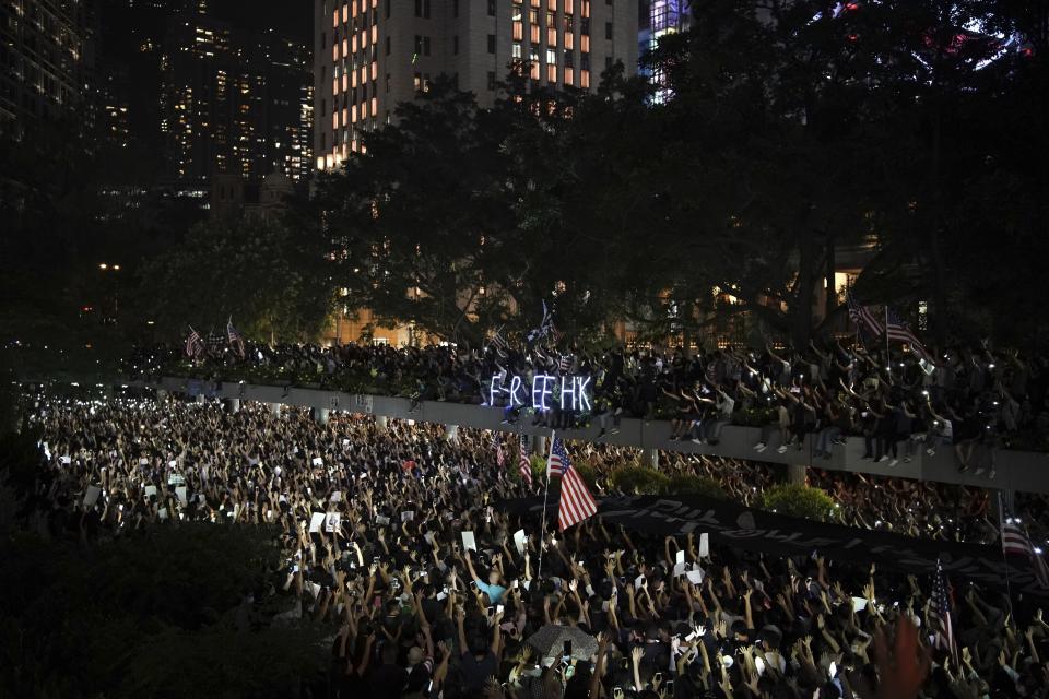 Protestors gather for a peaceful rally in central Hong Kong's business district, Monday, Oct. 14, 2019. The protests that started in June over a now-shelved extradition bill have since snowballed into an anti-China campaign amid anger over what many view as Beijing's interference in Hong Kong's autonomy that was granted when the former British colony returned to Chinese rule in 1997. (AP Photo/Felipe Dana)