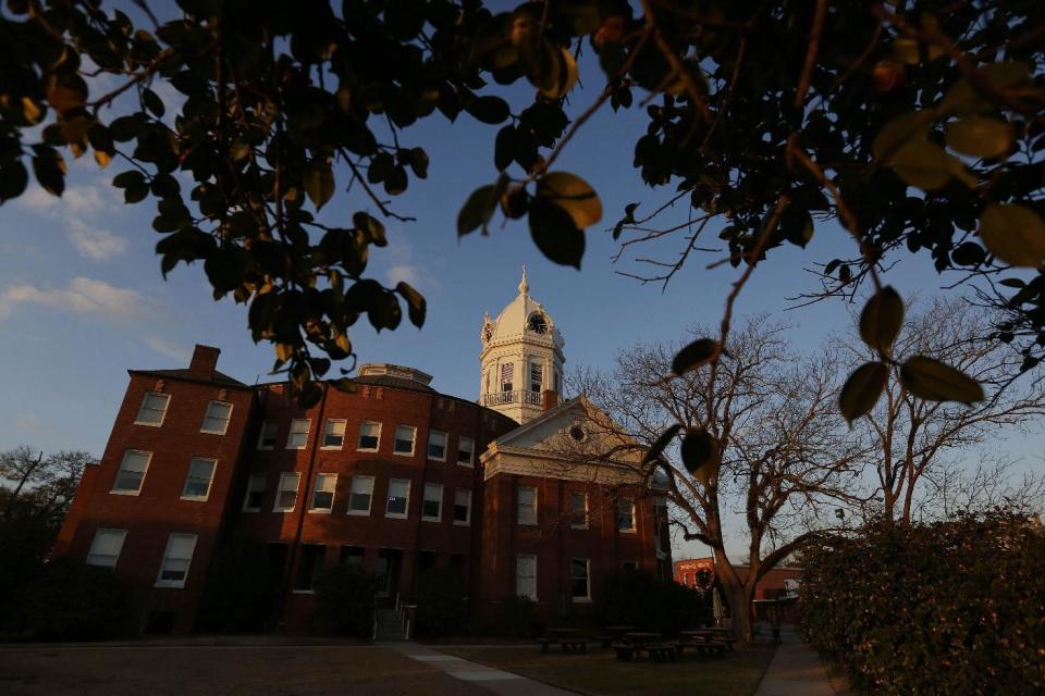 This Friday, Feb. 19, 2016 photo, shows the clock tower of the old courthouse at the Monroe County Heritage Museum in Monroeville, Ala., home to Harper Lee, the elusive author of best-seller "To Kill a Mockingbird." A group in the south Alabama city of Monroeville hopes to develop new attractions and draw more tourists to the hometown of the late "To Kill a Mockingbird" author. (AP Photo/Brynn Anderson)