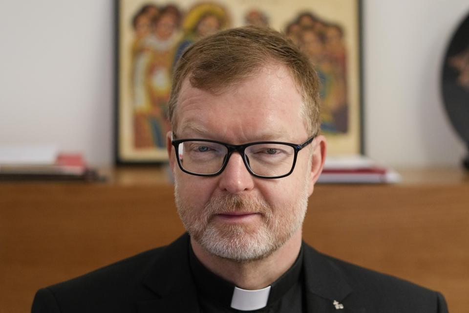 Hans Zollner, head of the new safeguarding institute at the Pontifical Gregorian University, poses for photos before an interview with the Associated Press, in Rome, Wednesday, Oct. 13, 2021. The Catholic Church’s foremost research and training institute into clergy sexual abuse of minors is expanding its mandate to also include the sexual and spiritual abuse of adults, evidence that the Vatican is increasingly aware that children aren’t the only victims of clergy who abuse their power and authority. (AP Photo/Alessandra Tarantino)