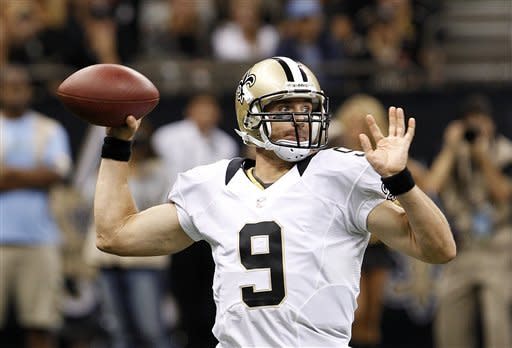 New Orleans Saints quarterback Drew Brees (9) passes in the first half of a preseason NFL football game against the Jacksonville Jaguars in New Orleans, Friday, Aug. 17, 2012. (AP Photo/Jonathan Bachman)