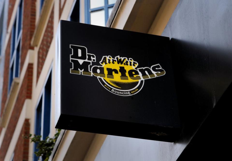 General view of a Dr Martens sign on the front of their shop in London The retailer saw shares slide after it posted a slowdown in sales over the latest quarter (Lauren Hurley/PA) (PA Archive)