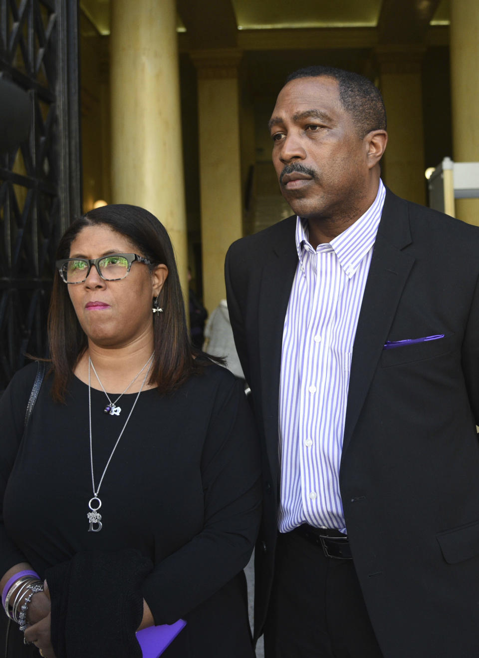 Phil and Jill Henderson parents of Bakari Henderson, face the media outside the court house in Patras, Greece, on Thursday, Nov. 22, 2018. A Greek court on Thursday convicted and sentenced six of nine suspects in the fatal beating of an American tourist in an island resort last year. Bakari Henderson, a 22-year-old of Austin, Texas, died after being beaten in the street following an argument in a bar in the popular Laganas resort area of Zakynthos island in July 2017. (AP Photo/Giannis Androutsopoulos)