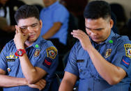 <p>Philippine National Police PO2 Alipio Balo Jr., left, and PO1 Michael Tomas, arrive to testify in the continuing Senate probe on the rising number of extrajudicial killings related to Philippine President Rodrigo Duterte’s “War on Drugs” Tuesday, Aug. 23, 2016 in suburban Pasay city south of Manila, Philippines. (AP Photo/Bullit Marquez) </p>