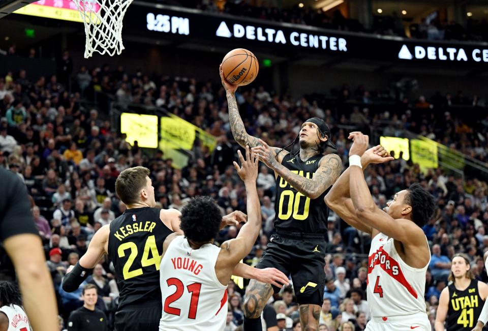 Utah Jazz guard Jordan Clarkson (00) drives to the hoop over Toronto Raptors forward <a class="link " href="https://sports.yahoo.com/nba/players/4290" data-i13n="sec:content-canvas;subsec:anchor_text;elm:context_link" data-ylk="slk:Thaddeus Young;sec:content-canvas;subsec:anchor_text;elm:context_link;itc:0">Thaddeus Young</a> (21) and Toronto Raptors forward <a class="link " href="https://sports.yahoo.com/nba/players/6515" data-i13n="sec:content-canvas;subsec:anchor_text;elm:context_link" data-ylk="slk:Scottie Barnes;sec:content-canvas;subsec:anchor_text;elm:context_link;itc:0">Scottie Barnes</a> (4) as the Jazz and Raptors play at the Delta Center in Salt Lake City on Friday, Jan. 12, 2024. Utah won 145-113. | Scott G Winterton, Deseret News