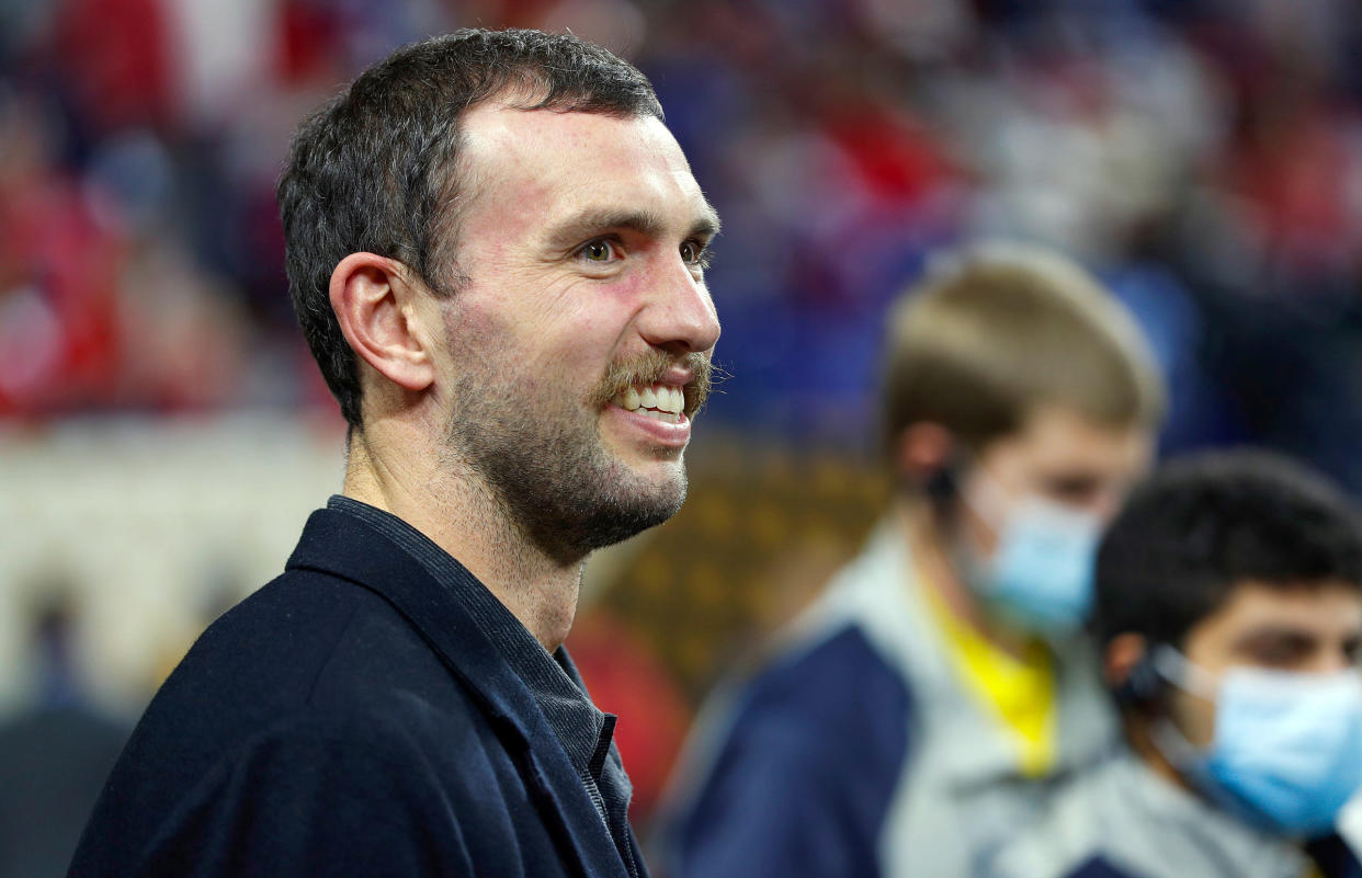 Jan 10, 2022; Indianapolis, IN, USA; Andrew Luck makes an appearance on the field before the start of the College Football Playoff National Championship on Monday, Jan. 10, 2022, at Lucas Oil Stadium in Indianapolis. Mandatory Credit: Jenna Watson-USA TODAY NETWORK