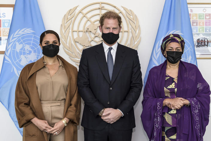 In this photo provided by the United Nations, U.S. Deputy Secretary-General Amina Mohammed, right, Meghan Markle, left, and Prince Harry stand together for a photo during a visit to U.N. headquarters during the the 76th session of the United Nations General Assembly on Saturday, Sept. 25, 2021. (Manuel Elías/U.N. via AP)