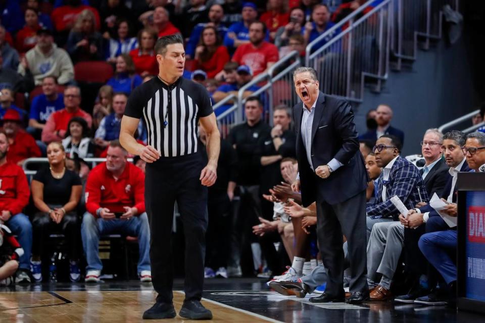 Kentucky head coach John Calipari yells at the referee after a foul was called against his team during Thursday’s game against the Louisville at the KFC Yum Center.