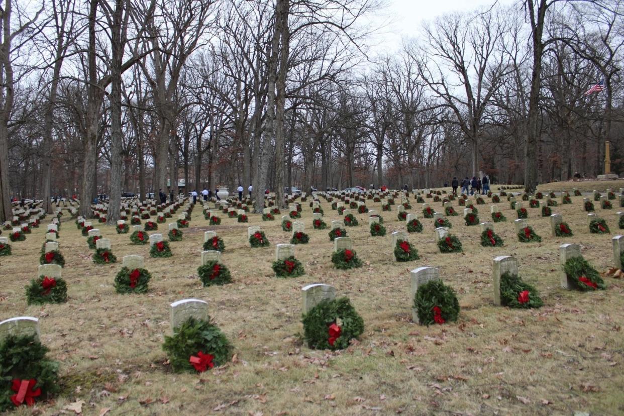 Every headstone at Indiana Veterans Home cemetery received a Christmas wreath in remembrance of their services. Members of Boy Scout Troop 372, along with other members of the community, helped places the decorations.