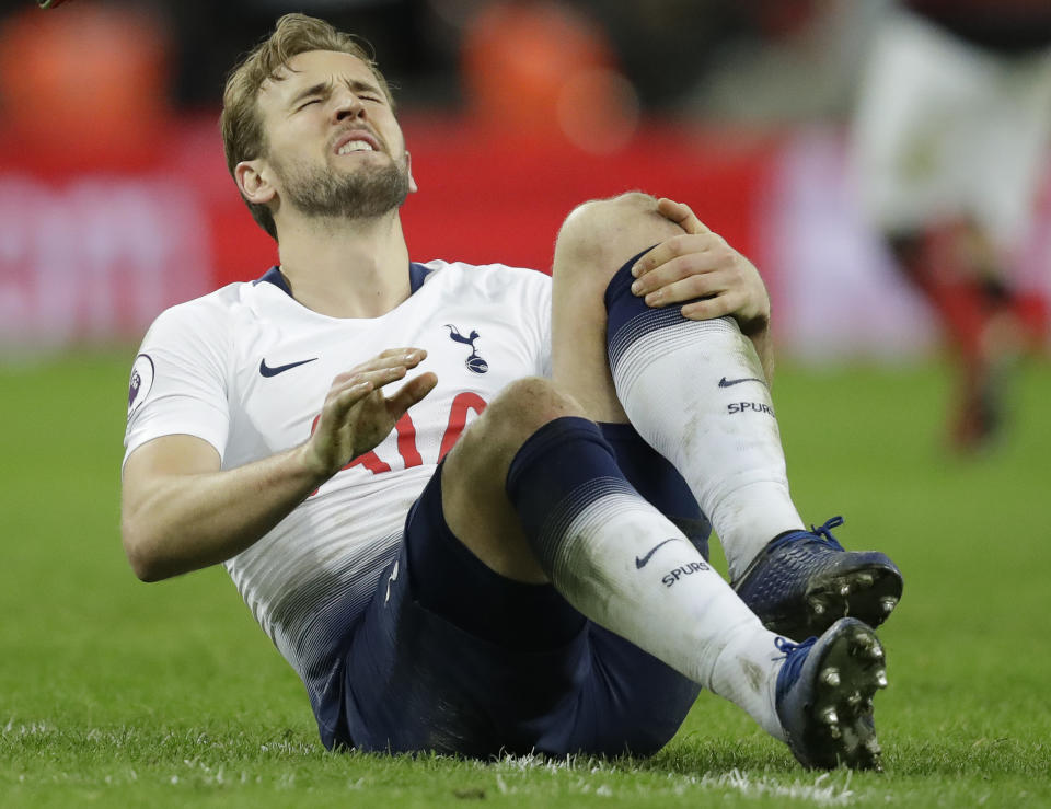 Tottenham's Harry Kane sits on the pitch with an injury after the English Premier League soccer match between Tottenham Hotspur and Manchester United at Wembley stadium in London, England, Sunday, Jan. 13, 2019. (AP Photo/Matt Dunham)