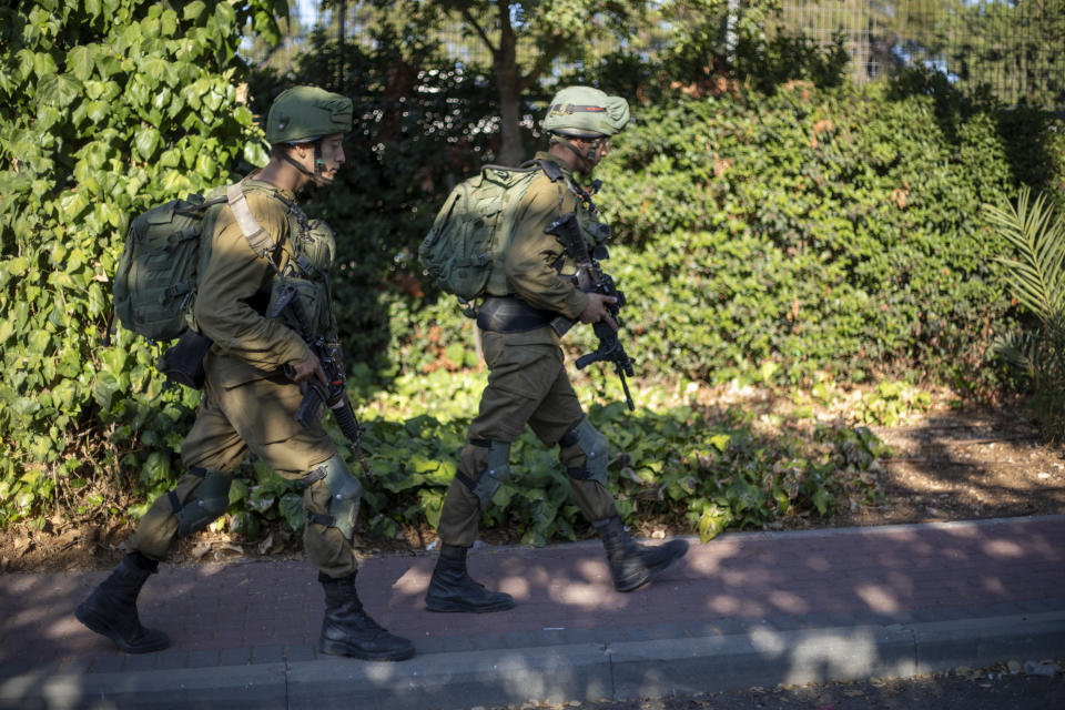 Israeli soldiers secure the village of Avivim on the Israel-Lebanon border, Monday, Sept. 2, 2019. Hezbollah militants on Sunday fired a barrage of anti-tank missiles into Israel, prompting a reprisal of heavy Israeli artillery fire in a rare burst of fighting between the bitter enemies. (AP Photo/Ariel Schalit)