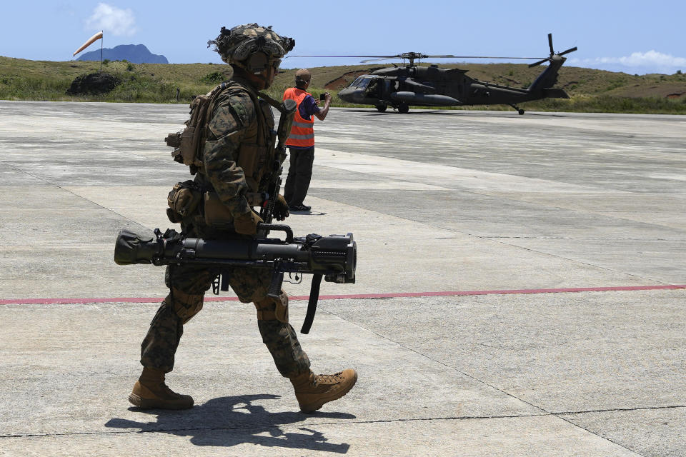 U.S. marines secure an area at the airport of the Philippines' northernmost town of Itbayat, Batanes province during a joint military exercise on Monday, May 6, 2024. American and Filipino marines held annual combat-readiness exercises called Balikatan, Tagalog for shoulder-to-shoulder, in a show of allied military readiness in the Philippines' northernmost town facing southern Taiwan. (AP Photo/Aaron Favila)