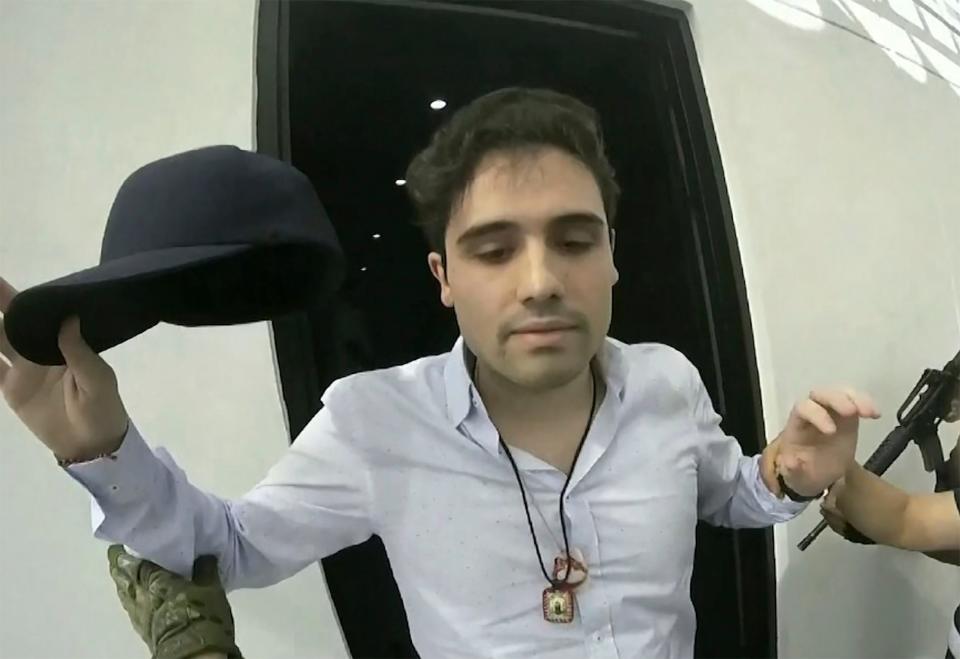 This Oct. 17, 2019 frame grab from a video provided by the Mexican government shows Ovidio Guzman Lopez at the moment of his detention, in Culiacan, Mexico. Mexican security forces were forced to release the son of Sinaloa cartel leader Joaquin "El Chapo" Guzman that day after his gunmen shot up the western city of Culiacan.