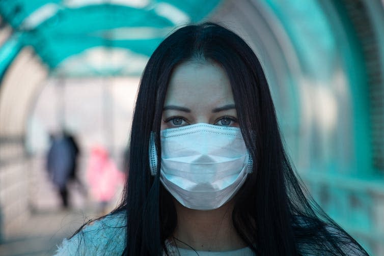 A person wearing a medical facemask