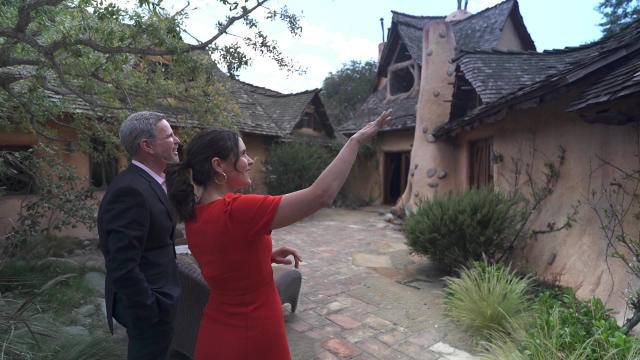 Correspondent Lilia Luciano with Michael J. Libow, owner of the 1921 Witch's House.&nbsp; / Credit: CBS News
