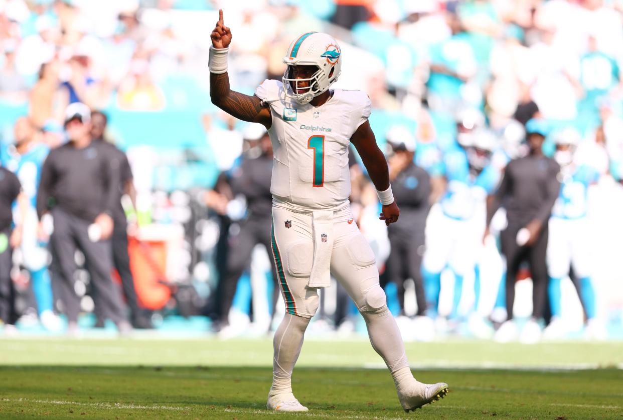 MIAMI GARDENS, FLORIDA - OCTOBER 15: Tua Tagovailoa #1 of the Miami Dolphins reacts after a touchdown during the fourth quarter in the game against the Carolina Panthers at Hard Rock Stadium on October 15, 2023 in Miami Gardens, Florida. (Photo by Megan Briggs/Getty Images)