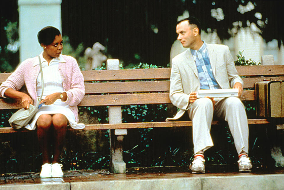 Forrest talking to a woman on the bench