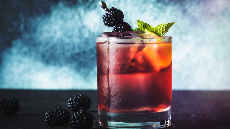 Blackberry whiskey smash cocktail