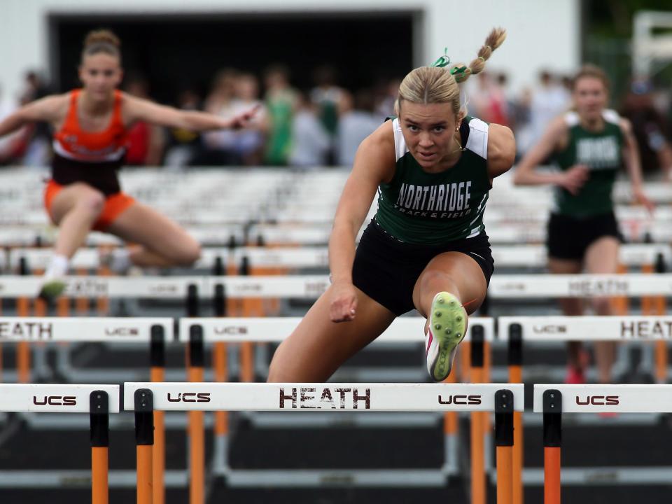 Northridge's Isabel Evans leads the Cardinal Division 100 hurdles during the Licking County League championships at Heath on Friday, May 10, 2024.