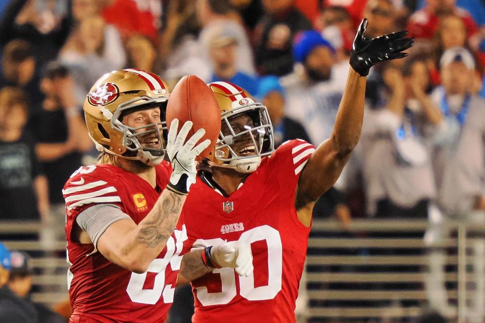 San Francisco 49ers tight end George Kittle (85) and safety George Odum (30) celebrates after a play against the Detroit Lions during the second half of the NFC Championship football game at Levi's Stadium.