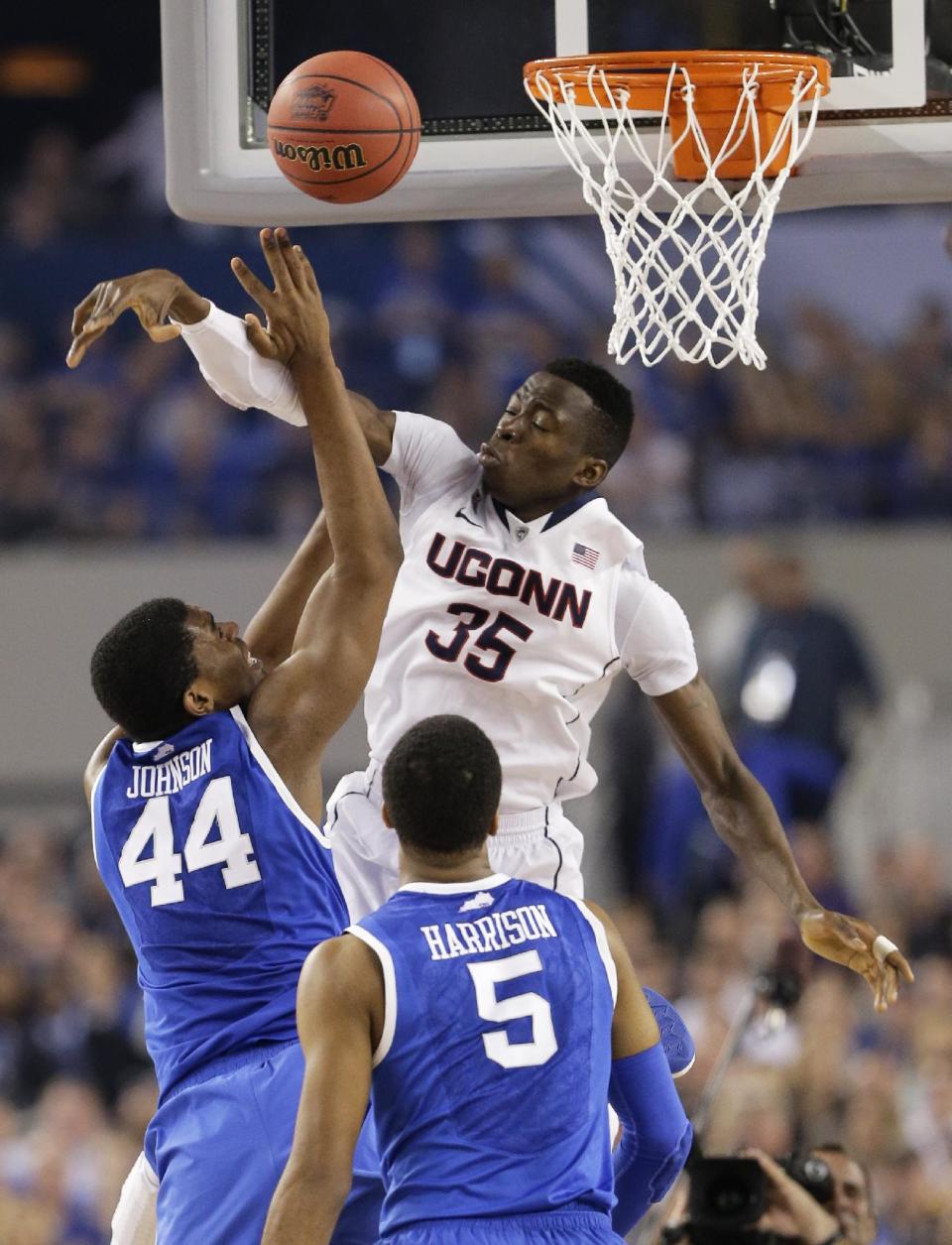 Connecticut center Amida Brimah (35) blocks a shot by Kentucky center Dakari Johnson (44) during the second half of the NCAA Final Four tournament college basketball championship game Monday, April 7, 2014, in Arlington, Texas. (AP Photo/Eric Gay)