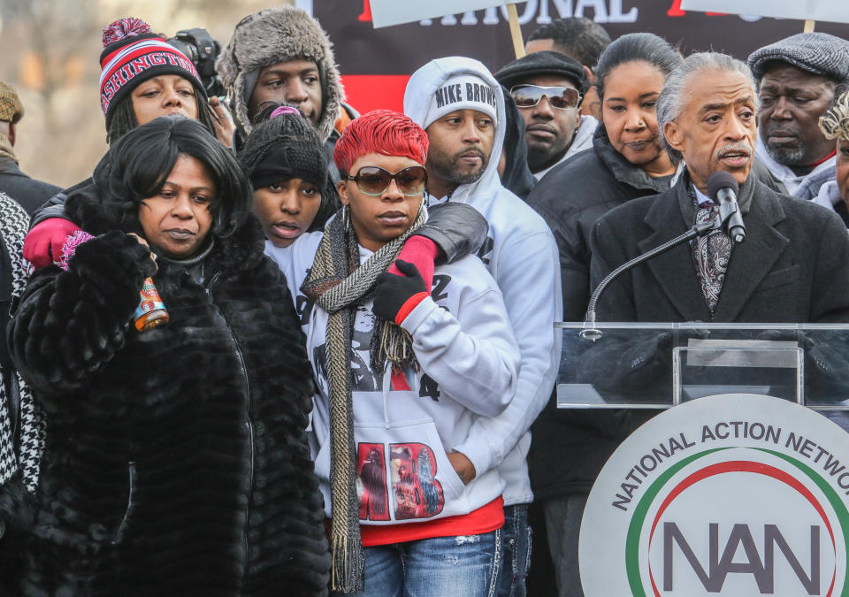 Samaria Rice (left), the mother of Tamir Rice, and Leslie McSpadden (right), the mother of Michael Brown, listen to Al Sharpton, at a march in Washington, D.C., on December 13, 2014. | Evelyn Hockstein/Washington Post—Getty Images