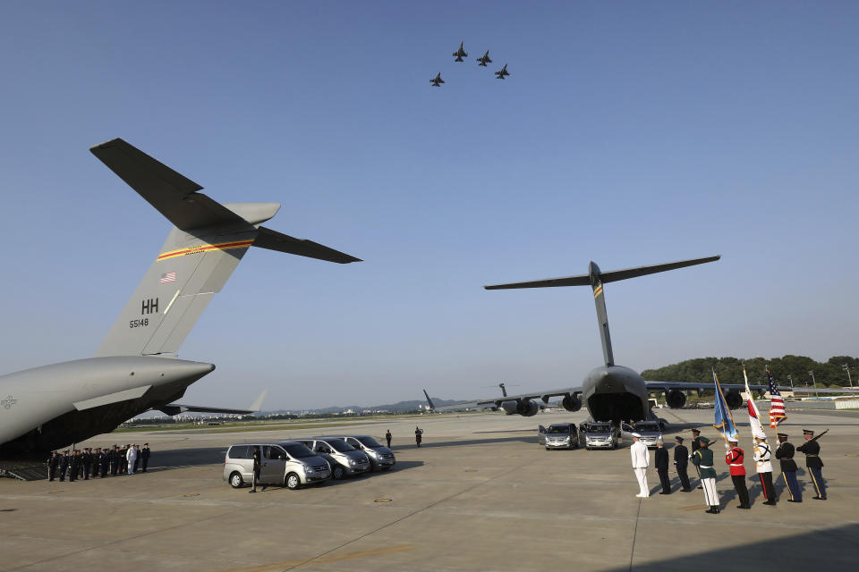 <p>Jets fly in formations overhead as U.N. honor guards carry the remains of U.S. servicemen killed in the Korean War and collected in North Korea, onto an aircraft at the Osan Air Base in Pyeongtaek, South Korea, Wednesday, Aug. 1, 2018. (Photo: Chung Sung-Jun/Pool Photo via AP) </p>