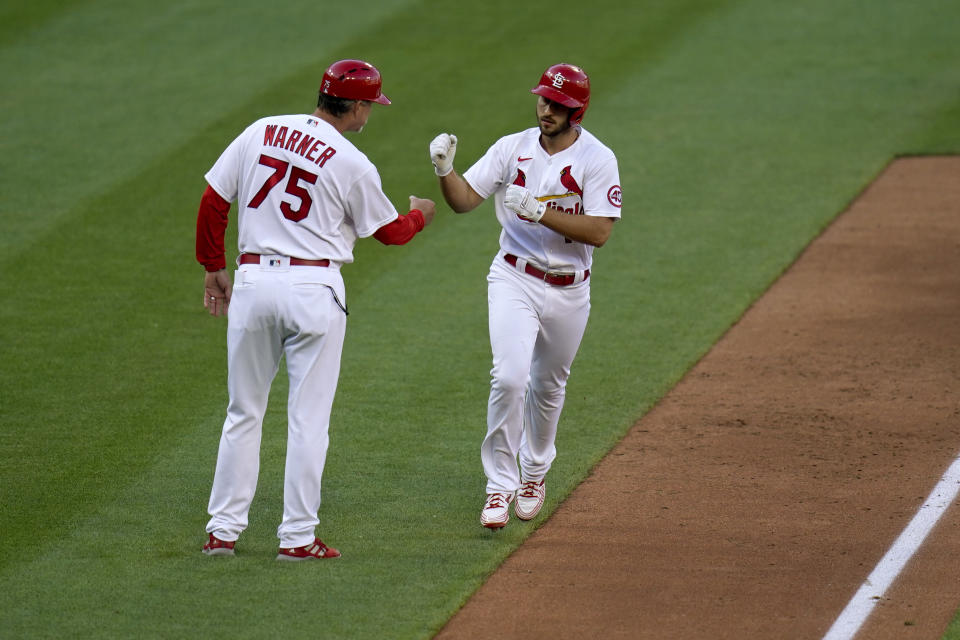 St. Louis Cardinals' Paul DeJong, right, is congratulated by third base coach Ron 'Pop' Warner (75) after hitting a two-run home run during the fifth inning in the first game of a baseball doubleheader against the New York Mets Wednesday, May 5, 2021, in St. Louis. (AP Photo/Jeff Roberson)