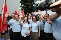 Workers Party's Lee Li Lian flanked by chief Low Thia Khiang and Sylvia Lim.