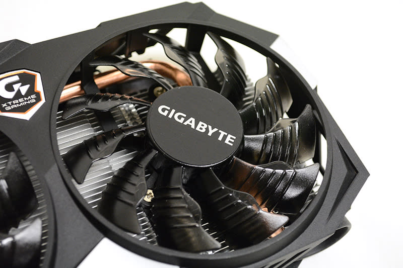 The fans feature a triangular protrusion and raised ridges to guide air through the heatsink.