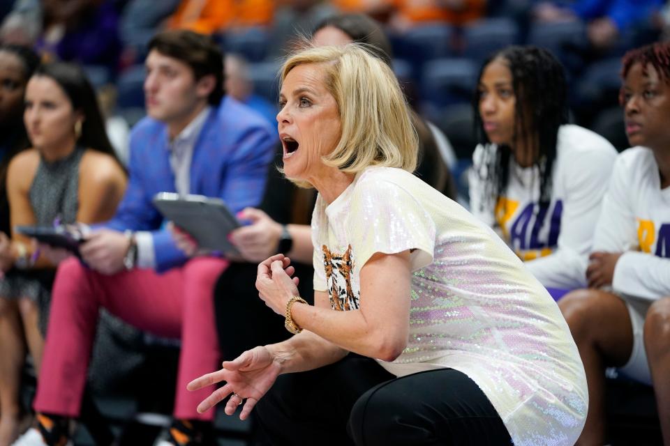 LSU head coach Kim Mulkey watches the action in the first half of an NCAA college basketball game against Kentucky at the women's Southeastern Conference tournament Friday, March 4, 2022, in Nashville, Tenn. (AP Photo/Mark Humphrey)