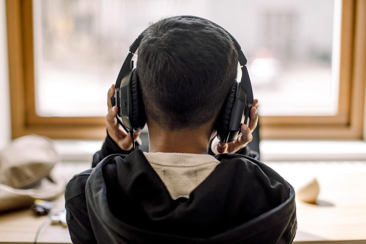 child with headphones on