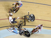 <p>Anna Knauer of Germany and Allison Beveridge of Canada crash during the women’s omnium 10km scratch race at the Olympic Velodrome in Rio on August 15, 2016. (REUTERS/Paul Hanna) </p>