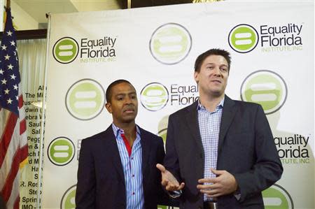 Plaintiffs Jeff Delmay (L) and Todd Delmay speak during a news conference at the LGBT Visitors Center in Miami Beach, Florida, January 21, 2014. REUTERS/Zachary Fagenson