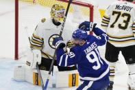 Toronto Maple Leafs' John Tavares (91) celebrates after a goal against Boston Bruins goaltender Jeremy Swayman (1) during second-period action in Game 6 of an NHL hockey Stanley Cup first-round playoff series in Toronto, Thursday, May 2, 2024. (Frank Gunn/The Canadian Press via AP)