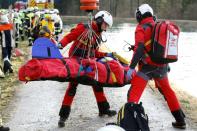 Rescue teams work at the site of a train accident near Bad Aibling, southern Germany, on February 9, 2016