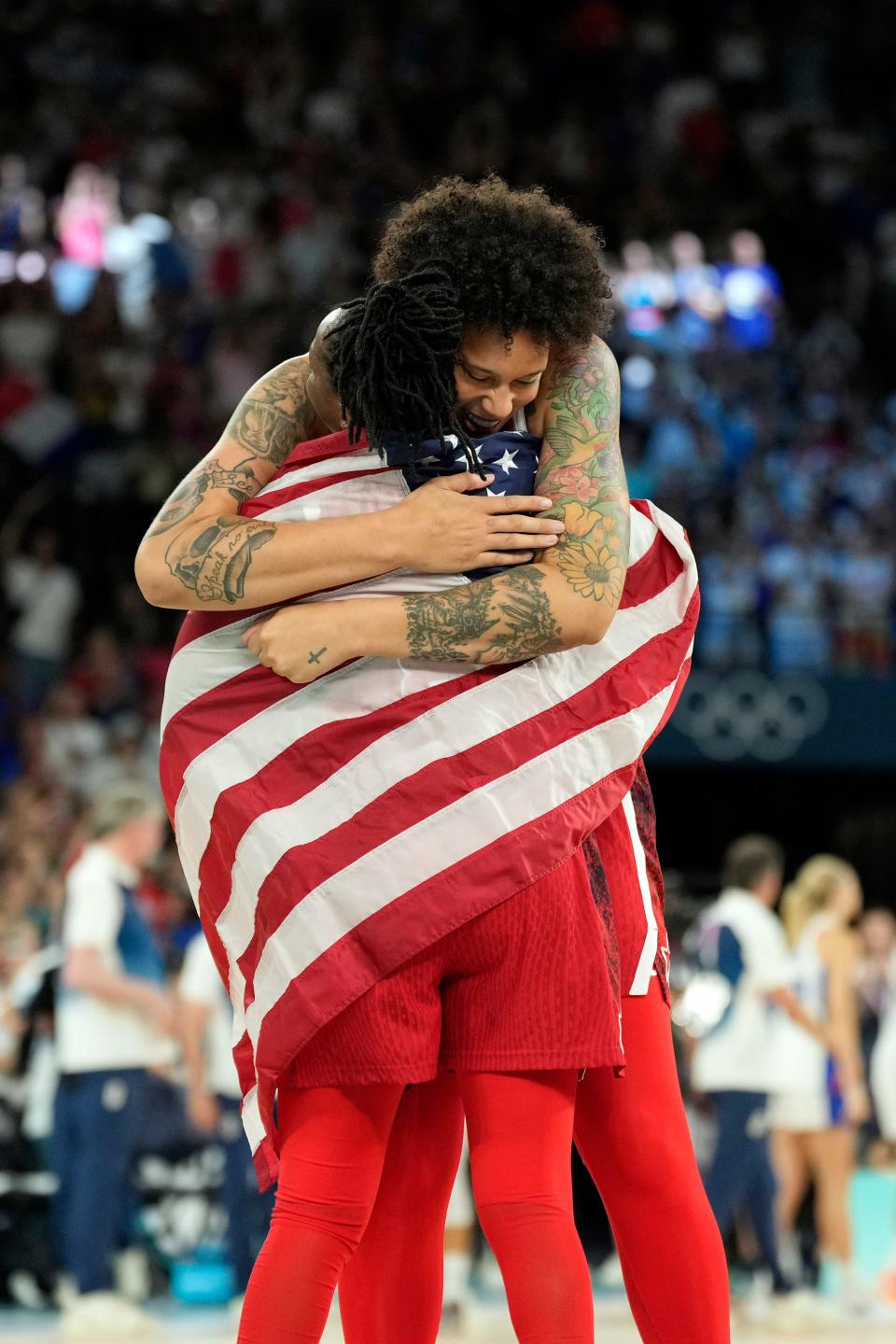 Aug 11, 2024; Paris, France; United States centre Brittney Griner (15) and guard Chelsea Gray (8) celebrate after defeating France in the women's gold medal game during the Paris 2024 Olympic Summer Games at Accor Arena. Mandatory Credit: Kyle Terada-USA TODAY Sports ORG XMIT: OLY-890073 ORIG FILE ID: 20240811_lbm_yz1_189.JPG