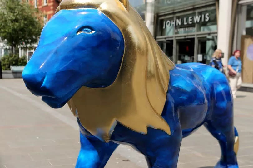 A lion outside John Lewis in Cheltenham High Street