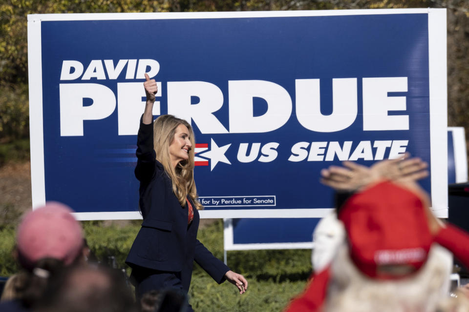 Sen. Kelly Loeffler, R-Ga., takes the stage before Vice President Mike Pence during a Defend the Majority Rally, Friday, Nov. 20, 2020 in Canton, Ga. (AP Photo/Ben Gray)