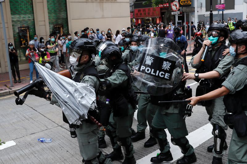 Umbrella is thrown at riot police during a march against Beijing's plans to impose national security legislation in Hong Kong