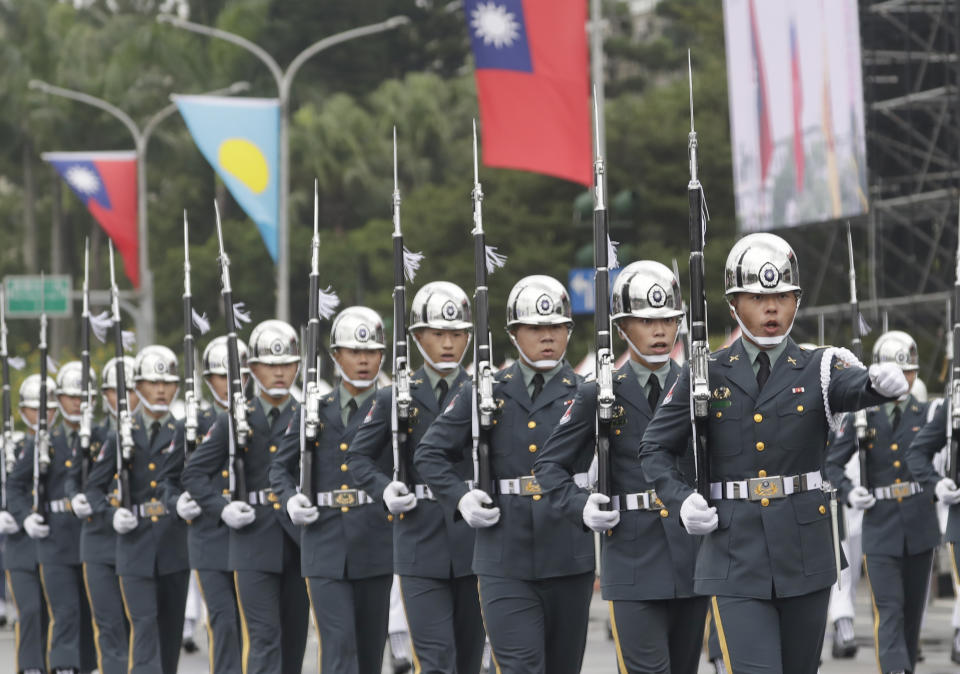 The military honor guard attend National Day celebrations in front of the Presidential Building in Taipei, Taiwan, Monday, Oct. 10, 2022. (AP Photo/Chiang Ying-ying)