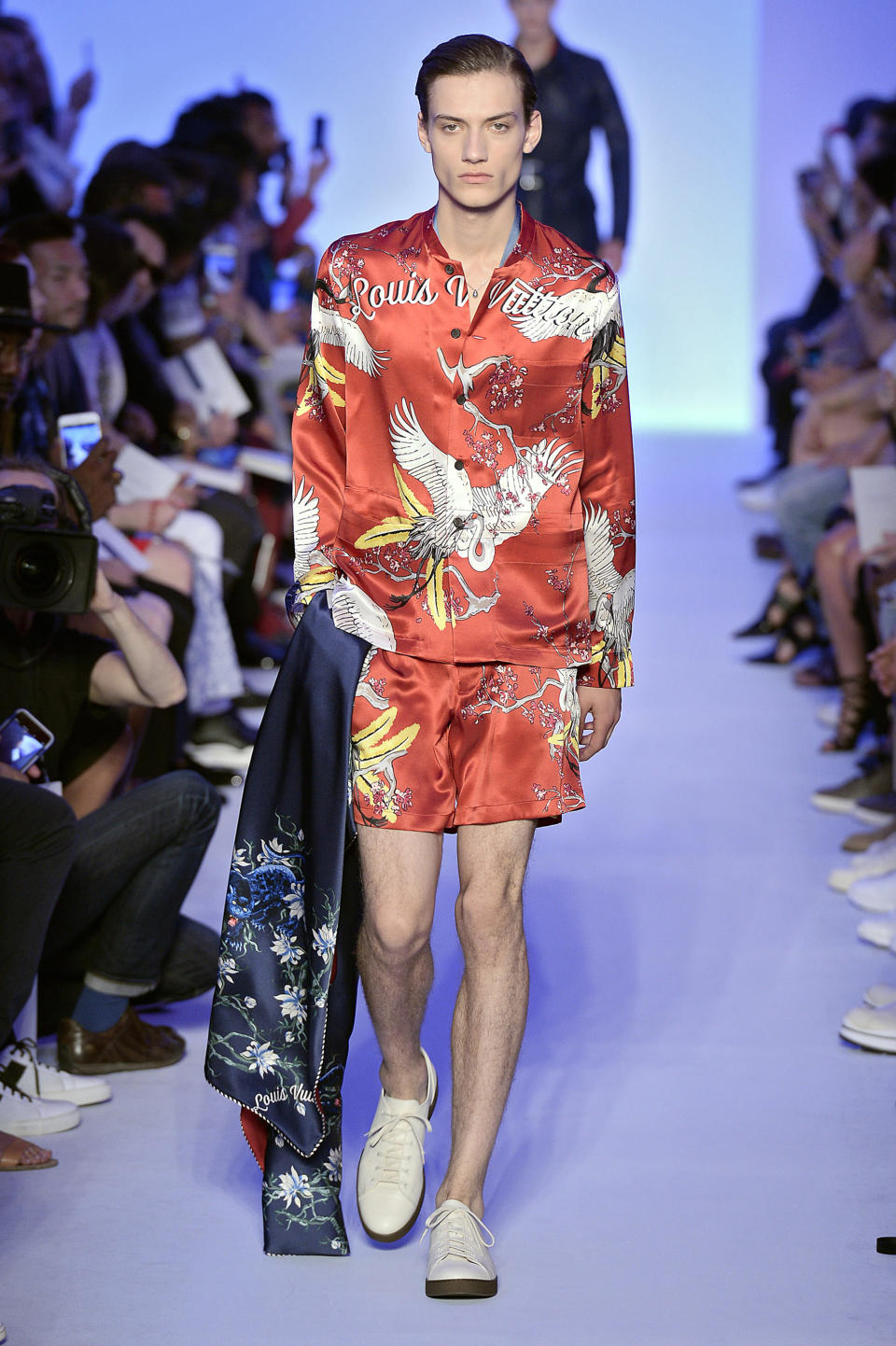 <p>Model wears a deep-red matching pajama set, featuring a vibrant Asian-inspired motif. (Photo: Catwalking) </p>