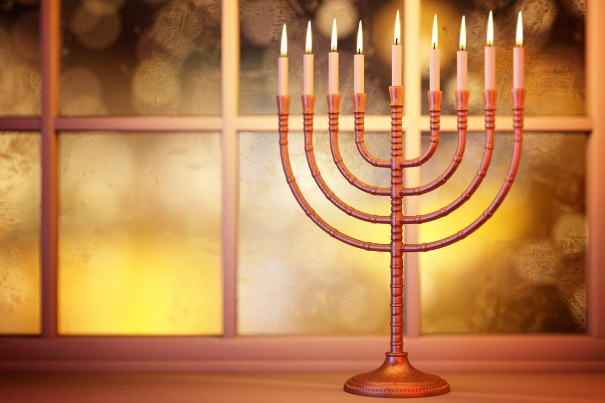 Hanukkah menorah on window background