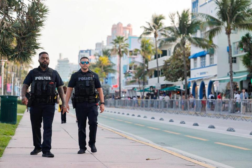 North Miami police officers Osvald Salien and Orestes Torres patrol Ocean Drive during spring break in Miami Beach, Florida, on Saturday, March 9, 2024.