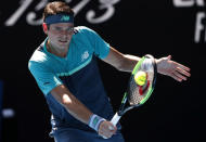 Tennis - Australian Open - Fourth Round - Melbourne Park, Melbourne, Australia, January 21, 2019. Canada’s Milos Raonic in action with Germany's Alexander Zverev. REUTERS/Kim Kyung-Hoon