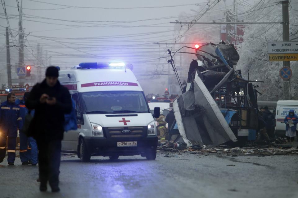 FILE - In this Monday, Dec. 30, 2013 file photo an ambulance leaves the site of an explosion after a bomb blast tore through the trolleybus, background, in the city of Volgograd. A series of unexplained killings in southern Russia involving booby-trapped bombs has further heightened security fears ahead of next month's Winter Olympics in Sochi. A spokesman for Russia's main investigative agency, said in a statement that no motive had yet been found for killings on Wednesday Jan. 8, 2014 on the outskirts of Pyatigorsk, which is the center of an administrative district created in 2010 to coordinate efforts to combat the insurgency. (AP Photo/Denis Tyrin, File)