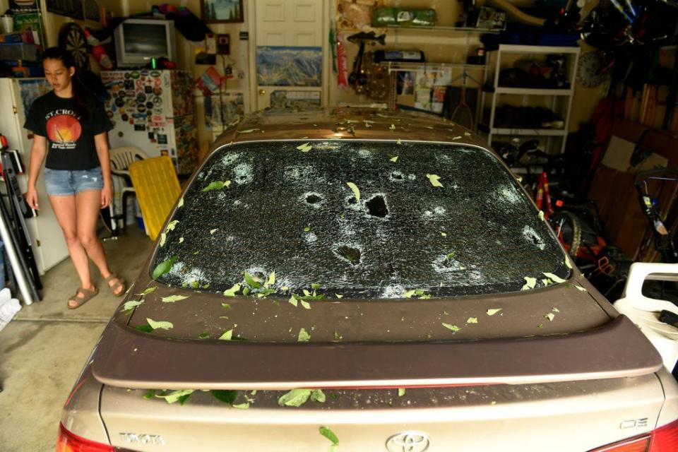Car back windshield destroyed from hail.
