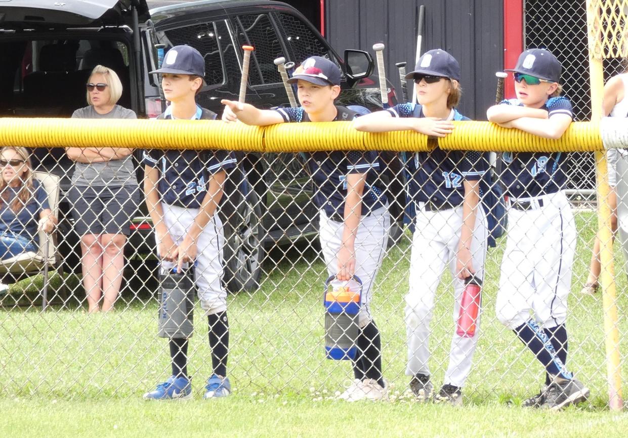 Teammates wait for their turn to play during this weekend's Tommy Slugfest, organized by Bucyrus Little League. The event brought 49 teams, along with parents and coaches, to town.