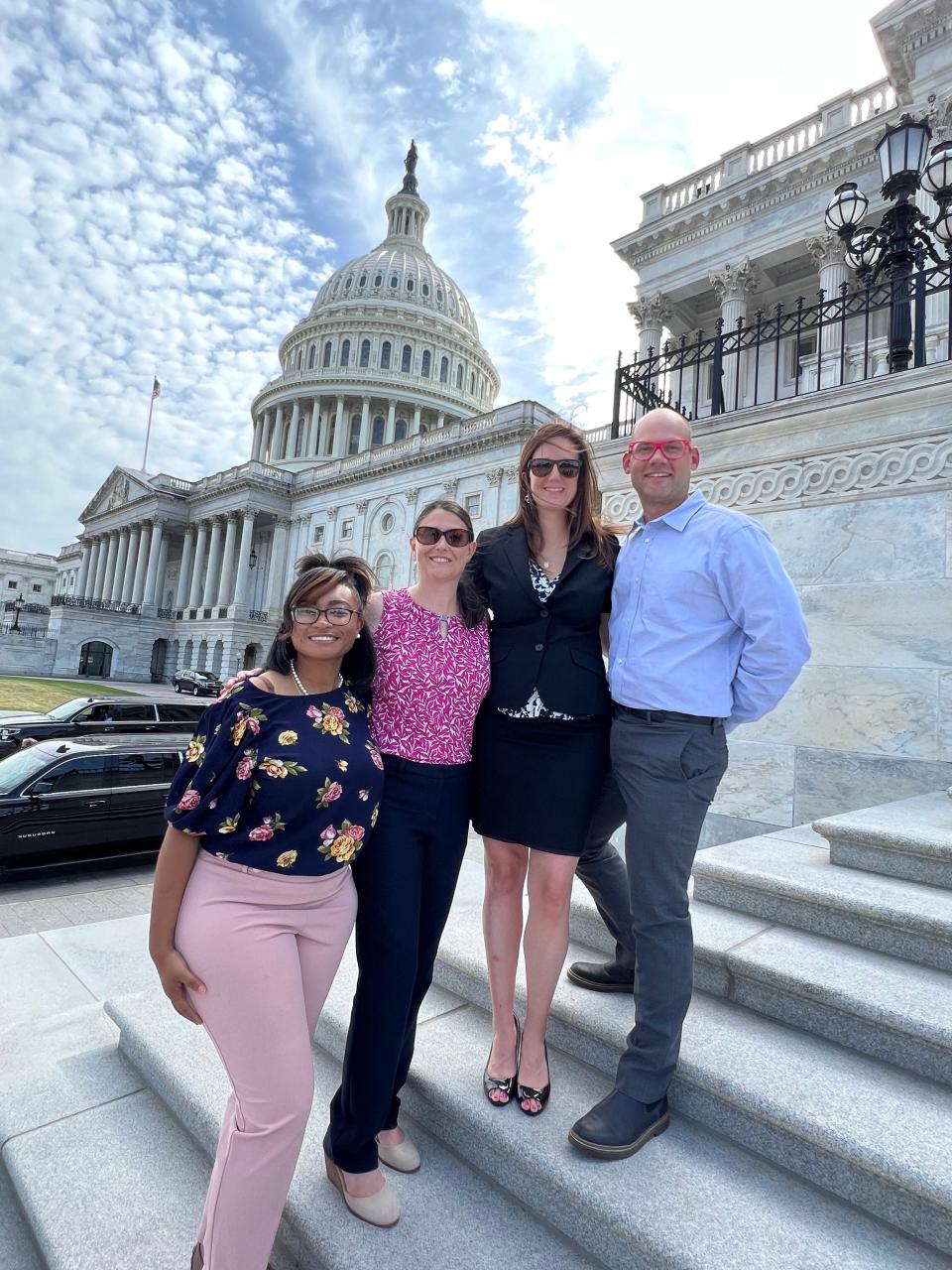 Whitney Austin, second from right, with her husband, Waller, far right, and friends at the U.S. Capitol. Austin, a shooting survivor, spent weeks in Washington in the run-up to the historic passage of the first major gun control act in decades.