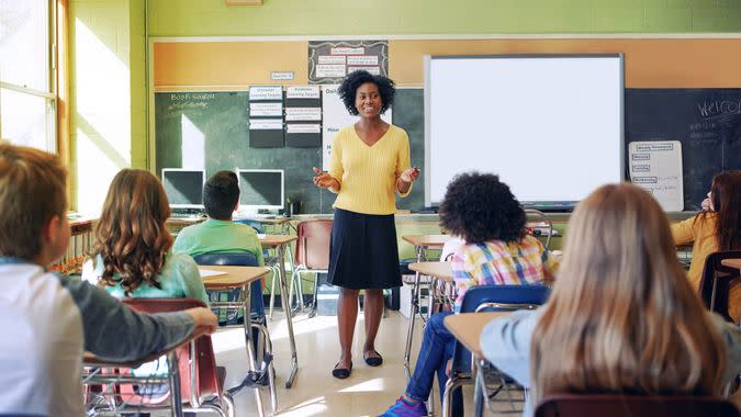 Shot of a young teacher educating a group of elementary children.